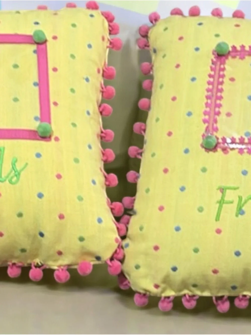 Yellow Polka Dot Accent Pillow with Pink Pom Trim